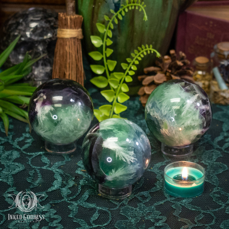 Load image into Gallery viewer, Feather Fluorite Sphere for Confident Optimism
